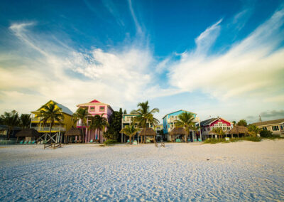 The-houses-near-a-beach-against-a-cloudy-sky-in-Estero-Island,-Florida