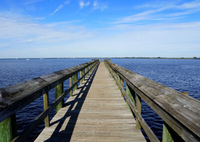 The-view-of-a-wooden-pier-by-the-blue-ocean-near-Punta-Gorda